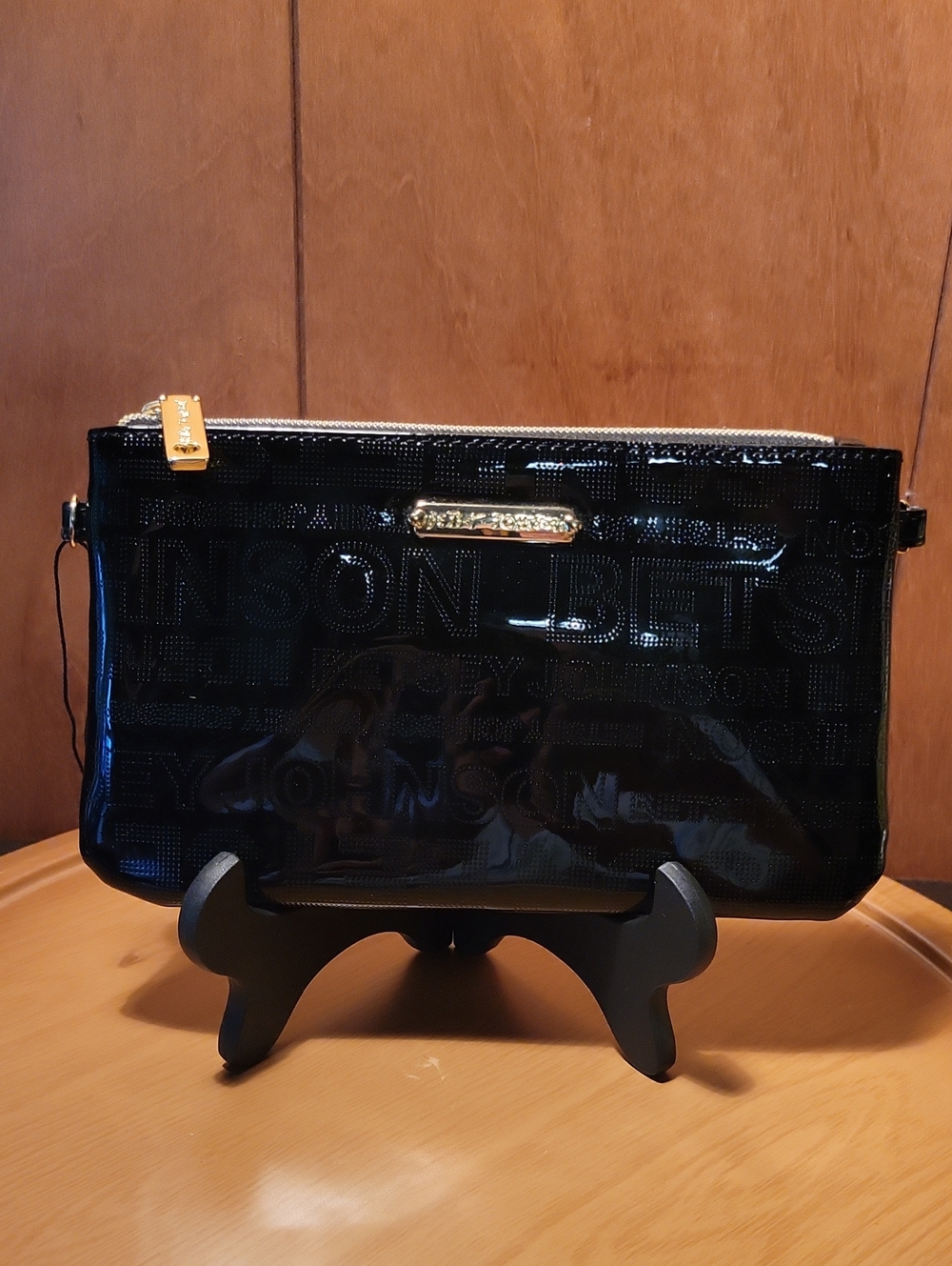 Betsey Johnson Black Patent Wristlet with Gold Accents and Cell Phone Charger